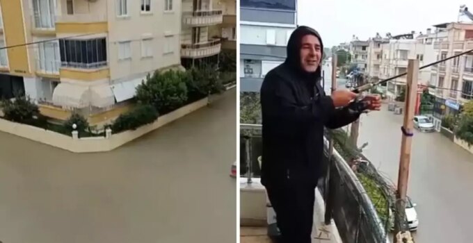 Sokaklar göle döndü ama o balkondan olta attı