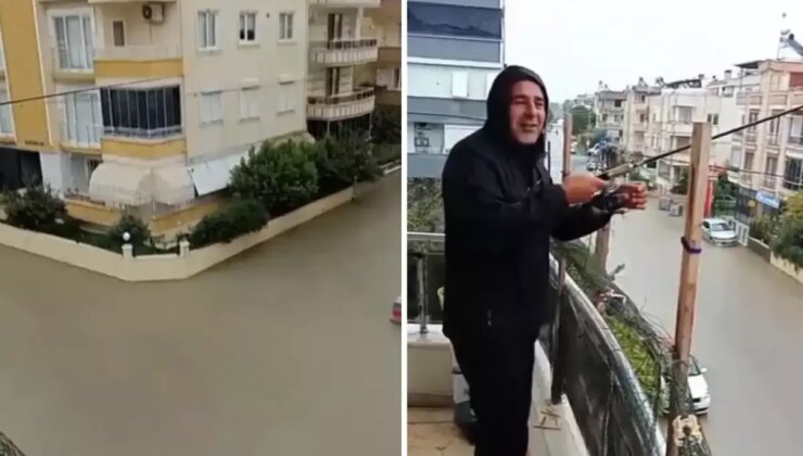 Sokaklar göle döndü ama o balkondan olta attı